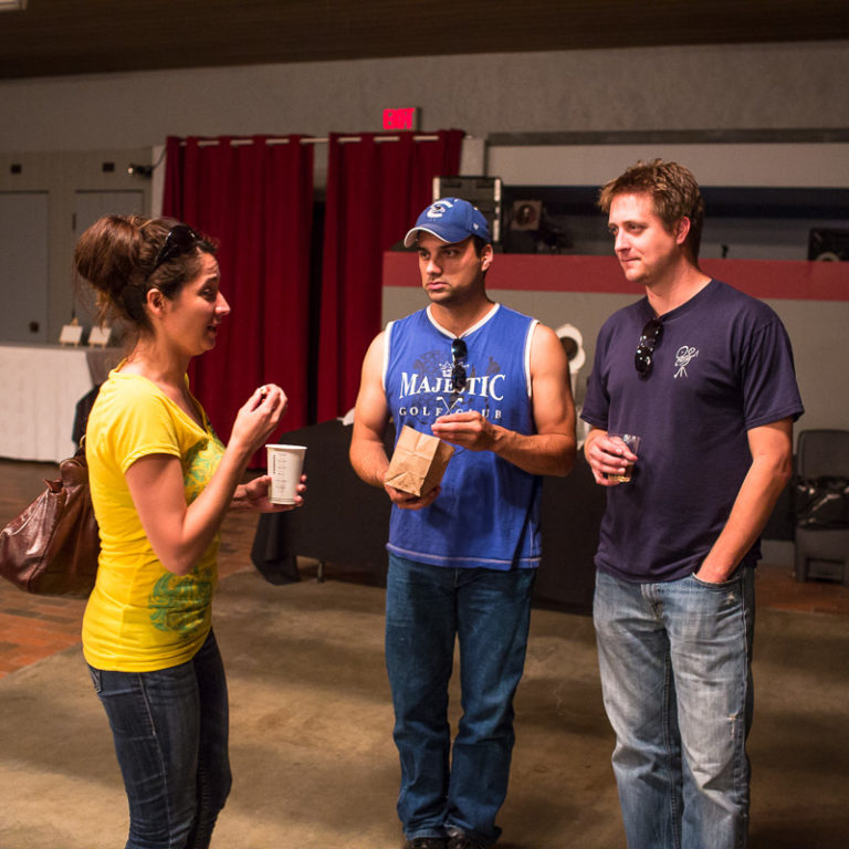 Left to right, Full Moon Cafe organizer and musician Briege Kealey chatting with actor and musician Travis L. Fowler and filmmaker Gordie Haakstad.